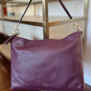 Kate Spade medium size satchel in berry purple/gold tone hardware. 12 x 9 1/2